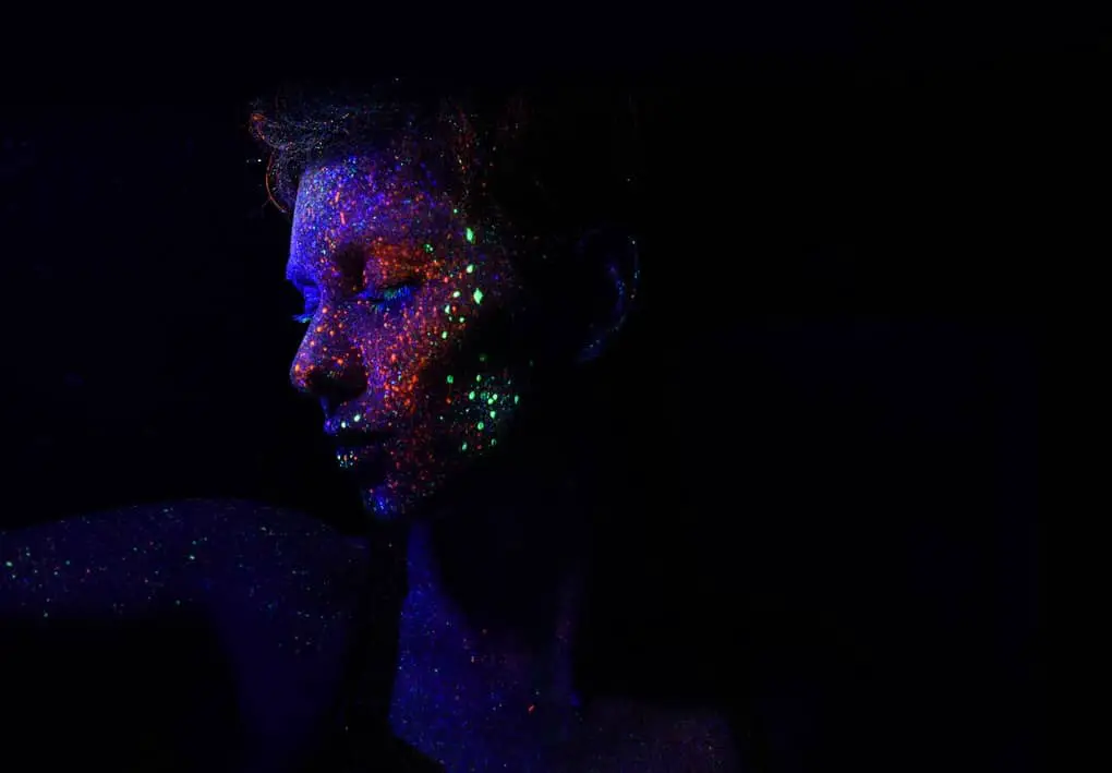 lady with colorful glitters on face