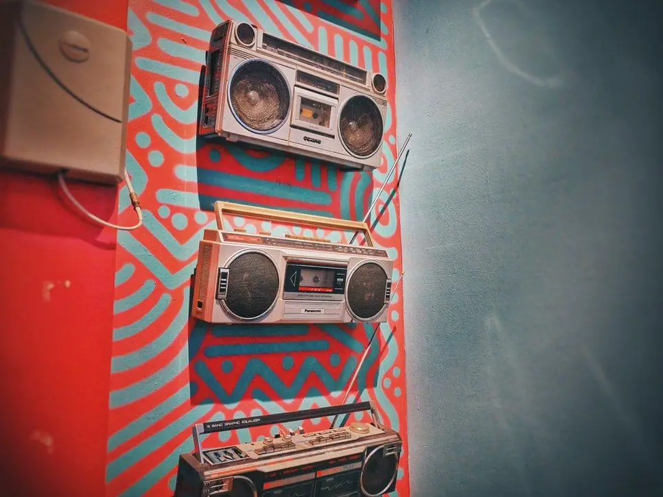 stack of boomboxes decorated for a 90s theme party