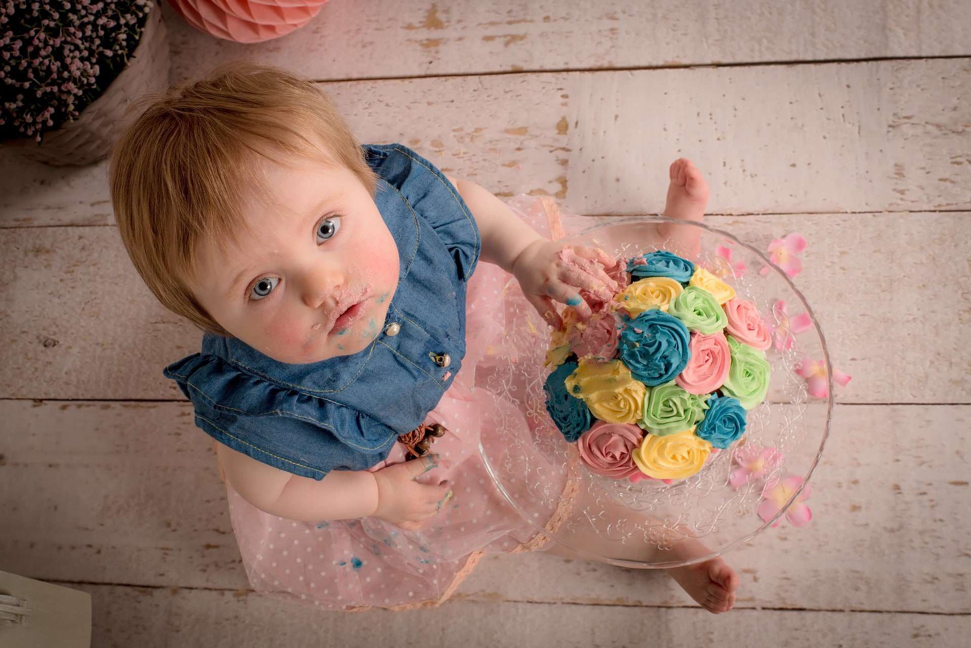 a 2 year old kid enjoying sweets