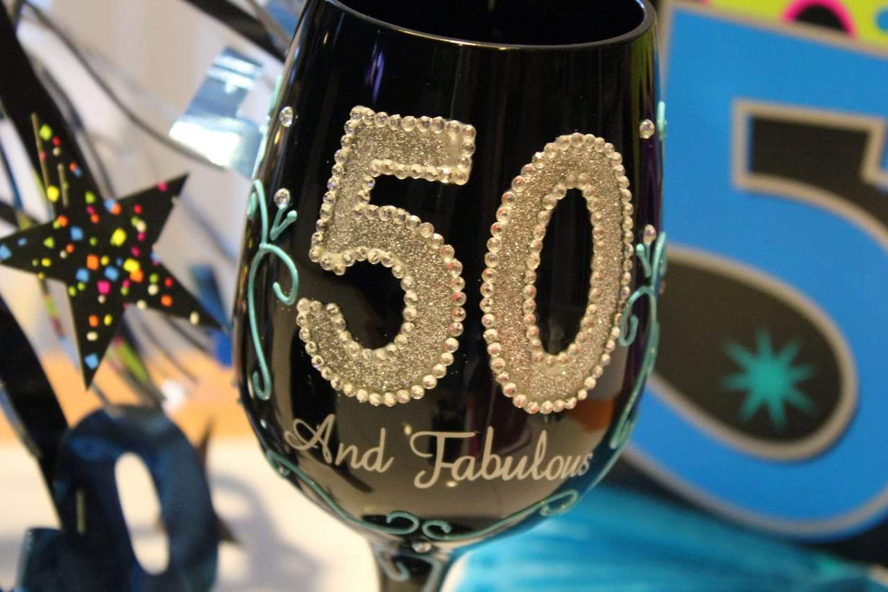 Gold and black stemware features in many 50th birthday party themes