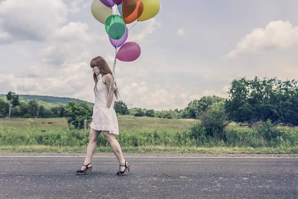 Girl Holding a Balloons