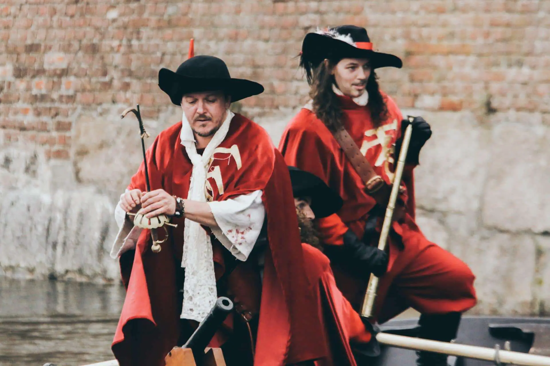 2 Men wearing a red pirate costomes