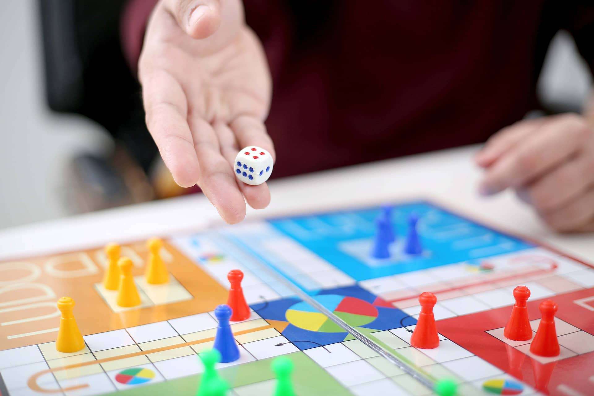 Man holding the dice and ready to release it to win for the game